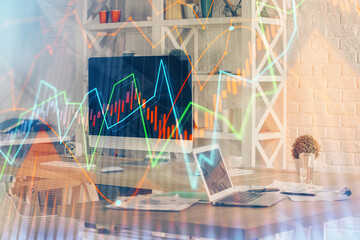 Financial market graph hologram and personal computer on background. Multi exposure. Concept of forex.