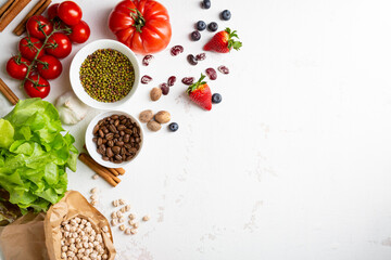 White food background with beans and berry