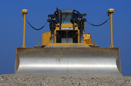 Lelystad, The Netherlands - September 24, 2017: Caterpillar (CAT) D6T LGP bulldozer sits at rest on landwinning construction site Marker Wadden. Front view.