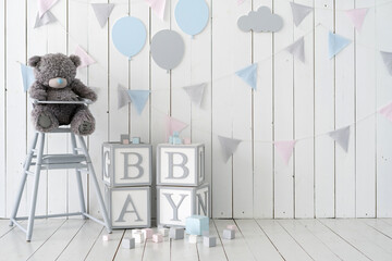 Word baby on wooden cubes near toys and decorated wall - obrazy, fototapety, plakaty