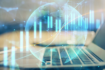 Double exposure of forex chart and work space with computer. Concept of international online trading.