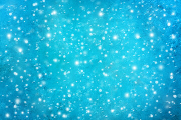 Turquoise grunge background with snow. Blue painted background. Christmas and New Year background.