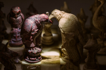 Сhess as an abstract concept. Beautiful antique chess set on marble chess board.