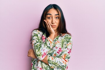 Young latin woman wearing casual clothes thinking looking tired and bored with depression problems with crossed arms.