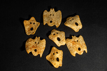 Halloween ghost chips on a black background
