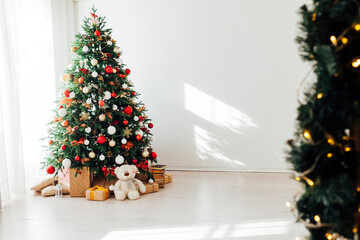Christmas tree by the window interior of the room New Year holiday gifts