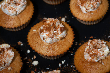 portioned mini cakes with whipped cream, top view