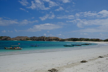 Fototapeta na wymiar Indonesia Lombok - Tanjung Aan Beach with outrigger boats - Pantai Tanjung Aan