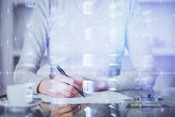 Double exposure of writing hand on background with data solution technology hologram. Ai concept.