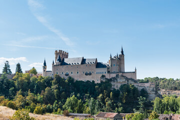 Low angle view of the Alcazar, a stone castle-palace located in the walled old city of Segovia, Spain.