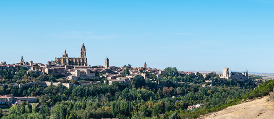 Naklejka premium Panorama view of the old wall and town of Segovia, with some of its main monuments to be recognised.