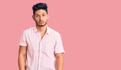 Handsome latin american young man wearing casual summer shirt depressed and worry for distress, crying angry and afraid. sad expression.