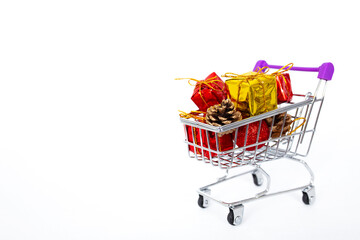 Christmas and New Year shopping. Shopping cart full of gifts
