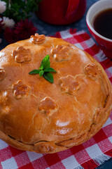 Festive traditional russian kurnik pie with pancakes, mushrooms, chicken, selective focus © Анна Журавлева