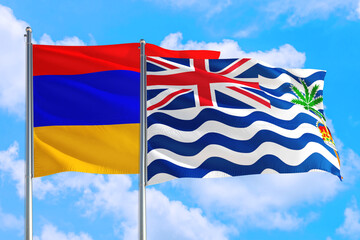 British Indian Ocean Territory and Armenia national flag waving in the windy deep blue sky. Diplomacy and international relations concept.