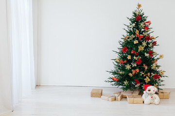 Christmas tree pine with gifts decor interior of the house new year