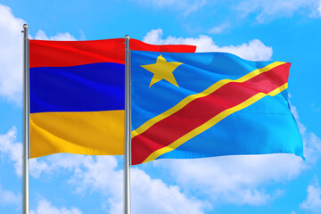 Congo and Armenia national flag waving in the windy deep blue sky. Diplomacy and international relations concept.