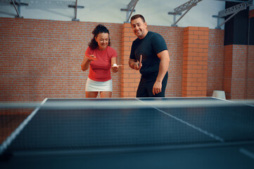 Man and woman on table tennis training, ping pong