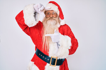 Old senior man with grey hair and long beard wearing santa claus costume smiling making frame with hands and fingers with happy face. creativity and photography concept.