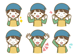 エプロンを着た男児の楽しい表情