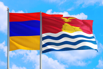 Kiribati and Armenia national flag waving in the windy deep blue sky. Diplomacy and international relations concept.