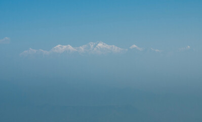 The view of the Kanchenjunga mountain covered by a mist.