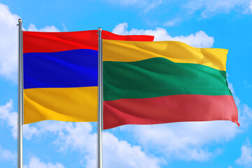 Fototapeta na wymiar Lithuania and Armenia national flag waving in the windy deep blue sky. Diplomacy and international relations concept.