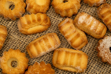 Homemade shortbread cookies on coarse burlap. Close up. Tea party.