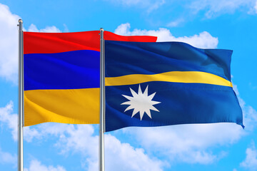 Nauru and Armenia national flag waving in the windy deep blue sky. Diplomacy and international relations concept.