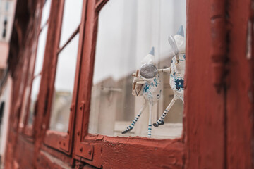 Small figures in the window 