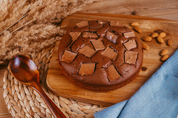 chocolate cake on a wooden background of the kitchen table