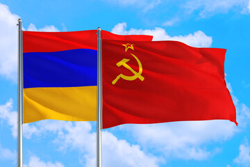 Soviet Union and Armenia national flag waving in the windy deep blue sky. Diplomacy and international relations concept.