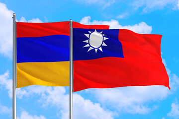 Taiwan and Armenia national flag waving in the windy deep blue sky. Diplomacy and international relations concept.