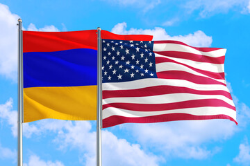 United States and Armenia national flag waving in the windy deep blue sky. Diplomacy and international relations concept.