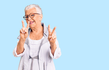 Senior beautiful woman with blue eyes and grey hair wearing casual clothes and glasses smiling looking to the camera showing fingers doing victory sign. number two.