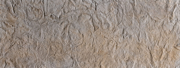 
The decorative plaster background looks like concrete, with blurring and darkening along the edges.