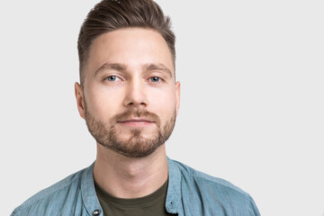 Obraz premium Handsome smiling young man portrait, Serious businessman studio shot, Isolated on gray background