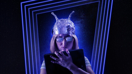 Girl in a foil hat against fantastic space theme background