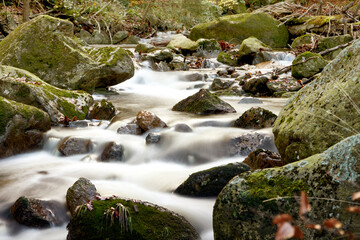 stream with stones in the mountains, white foaming gout alienated by long-term exposure