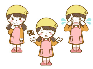 エプロンを着た女児の困った表情