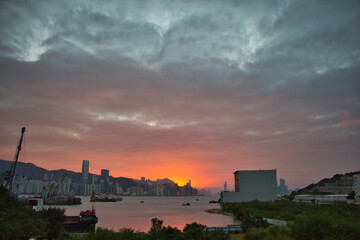 city skyline at sunset, view of Victoria Harbour, from Yau Tong, Kowloon, Hong Kong