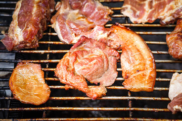 A piece of pork/beef meat had been grilled on charcoal oven. BBQ food close-up photo. 