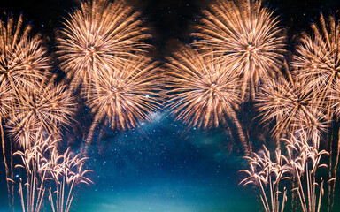 Colorful of fireworks display on milkyway in night sky background.