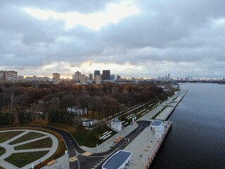 Aerial view panoramic cityscape with great height. River in a big city from a drone