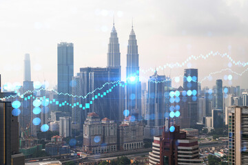 Naklejka na ściany i meble Forex and stock market chart hologram over panorama city view of Kuala Lumpur. KL is the financial center in Malaysia, Asia. The concept of international trading. Double exposure.
