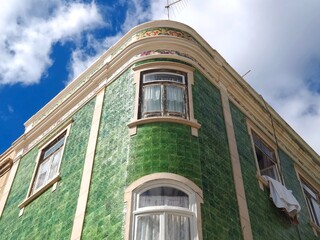 Fototapeta na wymiar The beauty of Portugal - famous house wit green tiles in Lagos