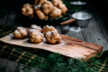 Profiteroles with custard on the table