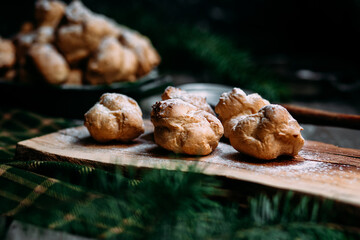 Profiteroles with custard on the table