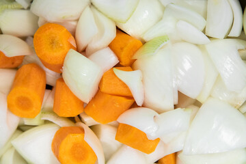 Coarsely chopped vegetables white onion and orange carrot