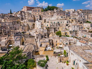 Fototapeta na wymiar Stunning view of Sasso Barisano district and its characteristic cave dwellings in the ancient town of Matera, Basilicata region, southern Italy 